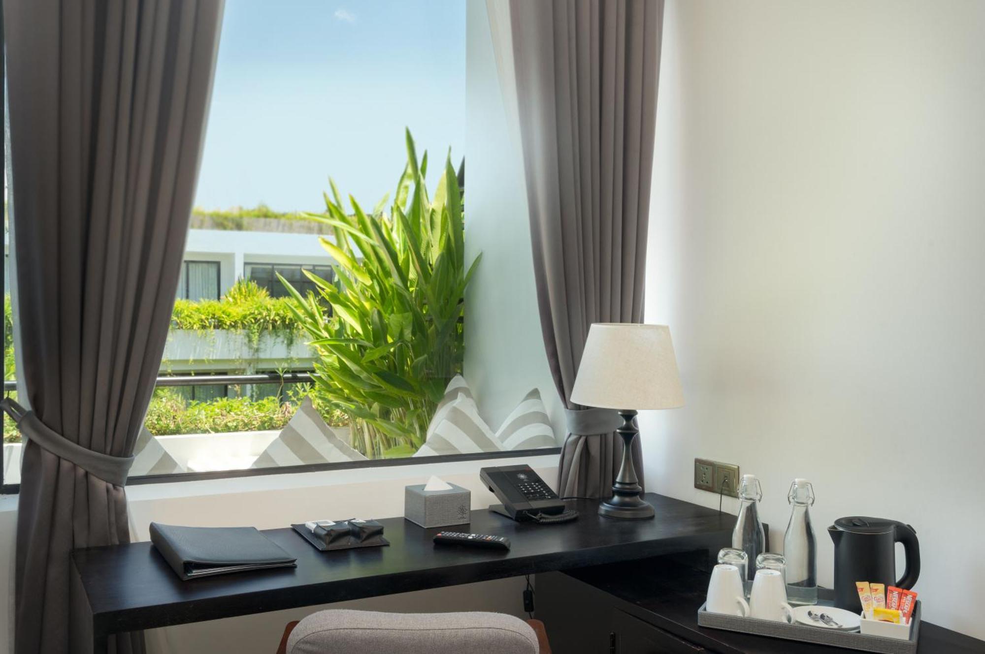 סיאם ריפ Eightfold Urban Resort מראה חיצוני תמונה A room at the hotel